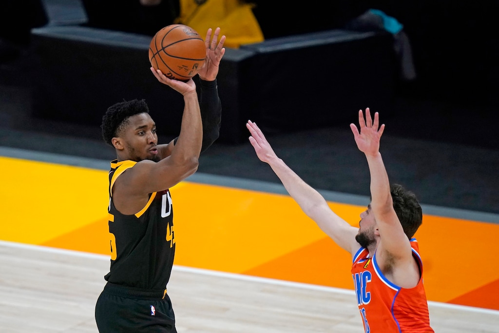 (Rick Bowmer | AP) Utah Jazz guard Donovan Mitchell shoots as Oklahoma City Thunder guard Ty Jerome defends during the first half of an NBA basketball game Tuesday, April 13, 2021, in Salt Lake City.