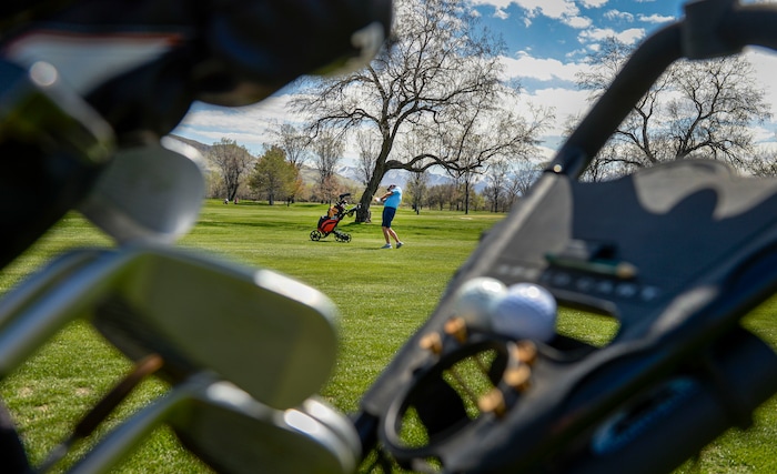 (Leah Hogsten | The Salt Lake Tribune) Kevin Pyle fires off the fairway at Rose Park Golf Course while playing with a friend, April 9, 2020. Despite the coronavirus and social distancing requirements, Pyle manages to play at least five times a week.