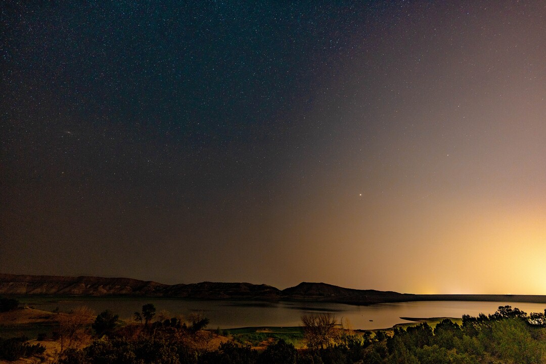 (Francisco Kjolseth | The Salt Lake Tribune) The city of Vernal glows in the distance as its lights refract with the smoke created by the California and Oregon fires, degrading the view of the night sky on Monday, Aug. 9, 2021.