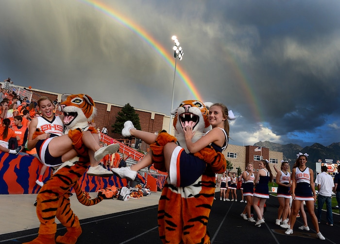 (Scott Sommerdorf  |  The Salt Lake Tribune)  Brighton mascots playfully ran off with cheerleaders as Brighton hosted rival Bingham in a 5A game played Friday, September 26, 2014.