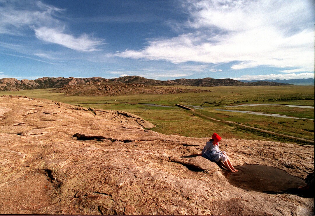 Rick Egan  | Tribune File Photo Jessica Hess, 14, Star Valley Wyoming, soaks her feet in a puddle of water on top of Independence Rock, after pulling a handcart all day.  