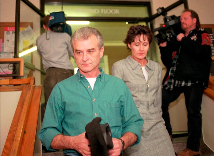 FILE - In this Dec. 16, 1997, file photo, Randy Weaver leaves the Boundary County courthouse in Bonners Ferry, Idaho, with his friend, Linda Thompson, after Weaver testified in the probable cause hearing of FBI sharpshooter Lon Horiuchi. It's been a quarter century since a standoff in the remote mountains of northern Idaho left a 14-year-old boy, his mother and a federal agent dead and sparked the expansion of radical right-wing groups across the country that continues to this day. (AP Photo/Jeff T. Green, File)