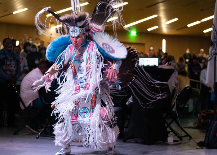 (Francisco Kjolseth | The Salt Lake Tribune) Christian Parrish Takes the Gun, known professionally as Supaman, performs a fancy dance for the start of the 15th Annual Governor’s Native American Summit held on the Utah Valley University campus on Friday, Aug. 6, 2021.