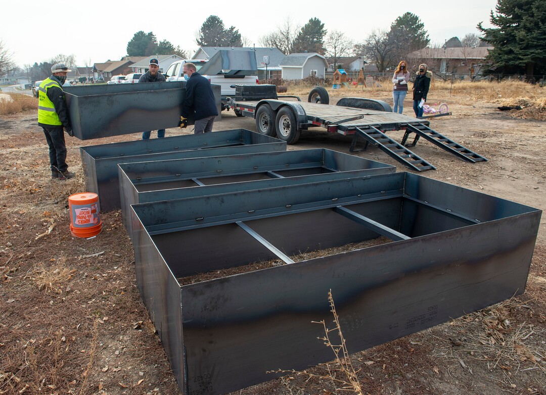 (Rick Egan | The Salt Lake Tribune)  Workers from Stratton and Brätt unload planter boxes  that will be placed on the small farm owned by Jennie Taylor's family, Thursday, Dec. 10, 2020.
