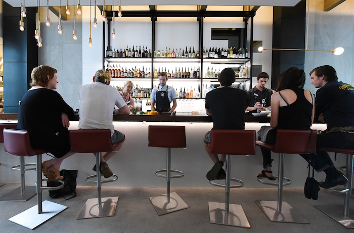 (Francisco Kjolseth  |  The Salt Lake Tribune)  Post Office Place, a new bar by the same owners as Takashi, located next door, welcomes patrons on Tuesday, June 19, 2018. One of the main reasons Takashi and Tamara Gibo opened this downtown watering hole is so that their patrons could have a drink while waiting for a seat at Takashi where the wait can sometimes be an hour long and liquor laws don't allow cocktails unless you are seated.