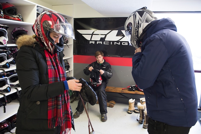 (Scott Sommerdorf   |  The Salt Lake Tribune)   
The Varvells get fitted for helmets prior to going out on snowmobiles to cut a Christmas tree. The Varvell family, visiting from Connecticut rented snowmobiles at Daniel Summit Saturday, December 23, 2017. While the number of snowmobile licenses in Utah is declining, trail usage is up dramatically.  