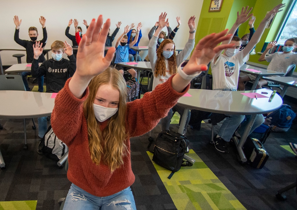 (Rick Egan | The Salt Lake Tribune) Olivia Harmon waves her arms with her class in movement exercises, at the beginning of Nicole Deaton's 8th grade health class at Shoreline Junior High in Layton, on Wednesday, Feb. 3, 2021.