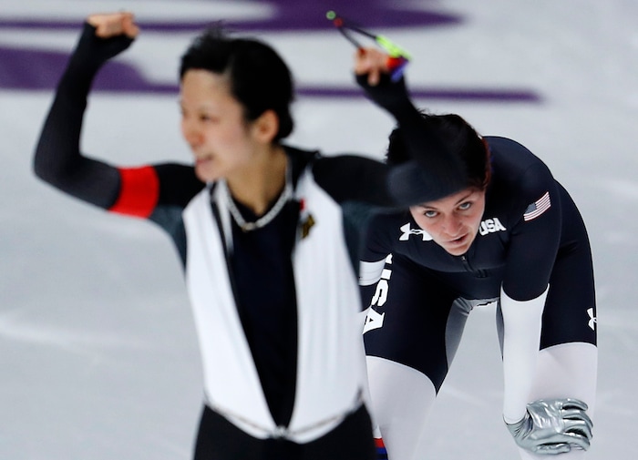 Heather Bergsma of the U.S., right, appears dejected while silver medallist Miho Takagi of Japan celebrates after the women's 1,500 meters speedskating race at the Gangneung Oval at the 2018 Winter Olympics in Gangneung, South Korea, Monday, Feb. 12, 2018. (AP Photo/John Locher)