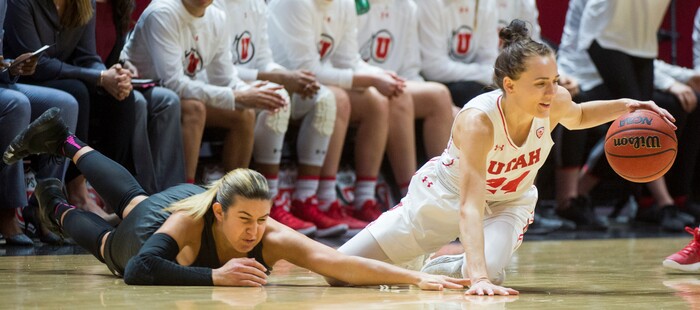 (Rick Egan  |  The Salt Lake Tribune)       Washington Huskies guard Amber Melgoza (4) goes for a loose ball along with Utah Utes guard/forward Tilar Clark (24), in PAC-12 women's basketball action at the Jon M. Huntsman Center, Sunday, Feb. 18, 2018.