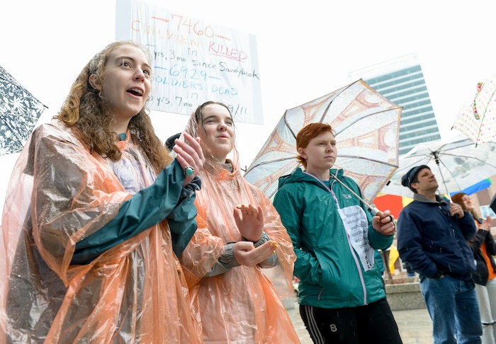 (Leah Hogsten | The Salt Lake Tribune) Demonstrators in support of gun reform at the Wallace F. Bennett Federal Building downtown during the #TownHallForOurLives march, Saturday, April 7, 2018, in response to a national call for town hall meetings issued by David Hogg, one of the leaders of the Parkland, FL #NeverAgain movement.