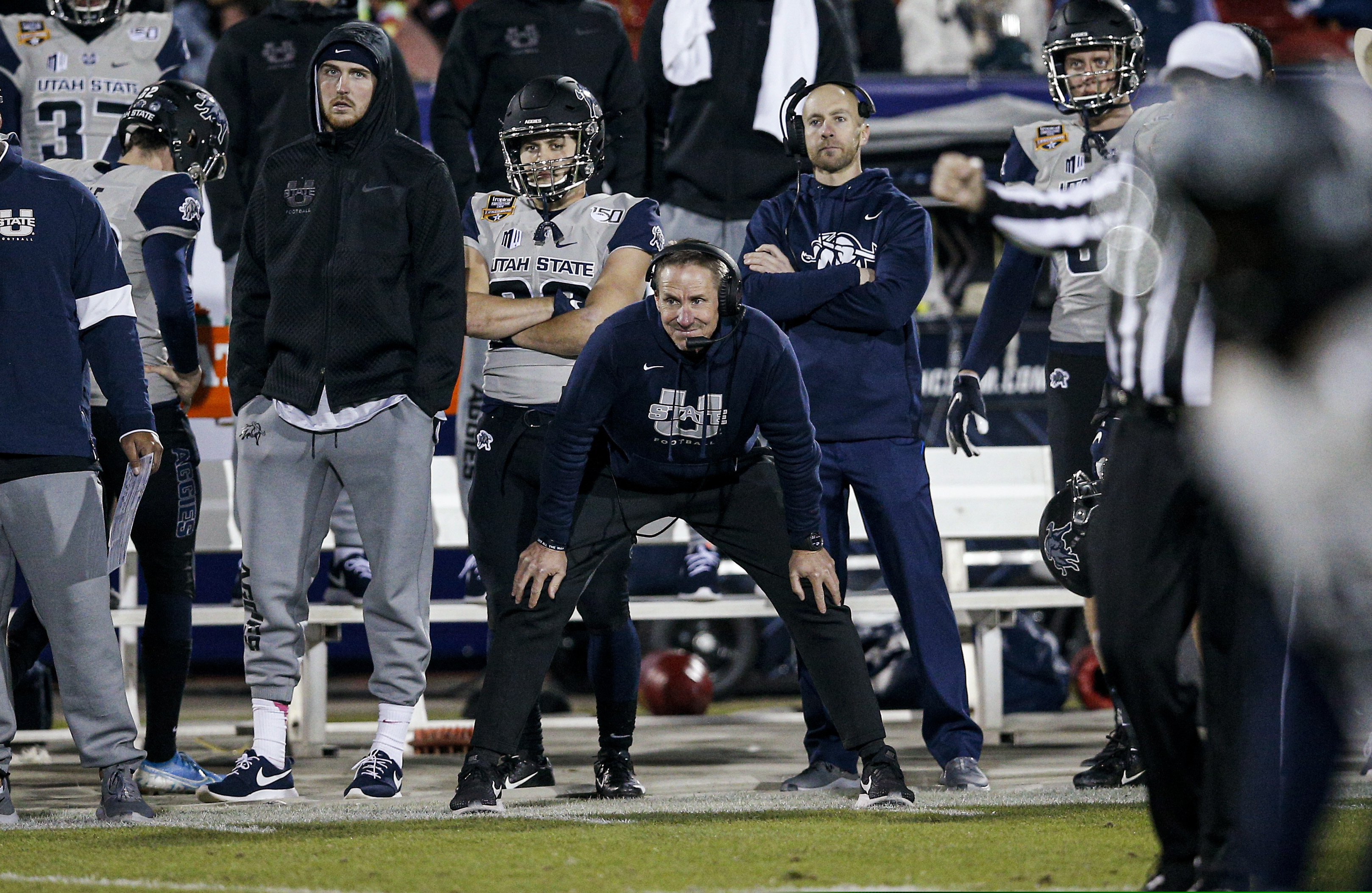 Utah State coach Gary Anderson watches from the sideline during the second half of the team's Frisco Bowl NCAA college football game against Kent State on Friday, Dec. 20, 2019, in Frisco, Texas. Kent State won 51-41. (AP Photo/Brandon Wade)