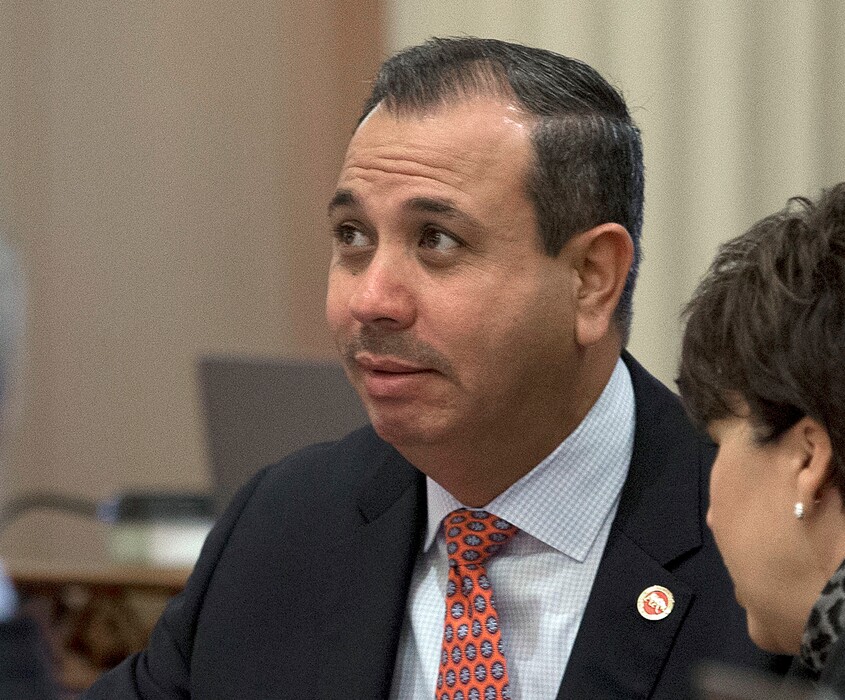 FILE - In this Aug. 26, 2016, file photo, state Sen. Tony Mendoza, D-Artesia, listens at the Capitol in Sacramento, Calif. The Los Angeles-area state senator is being investigated for allegations he engaged in inappropriate behavior toward a young female staffer.   (AP Photo/Rich Pedroncelli, File)