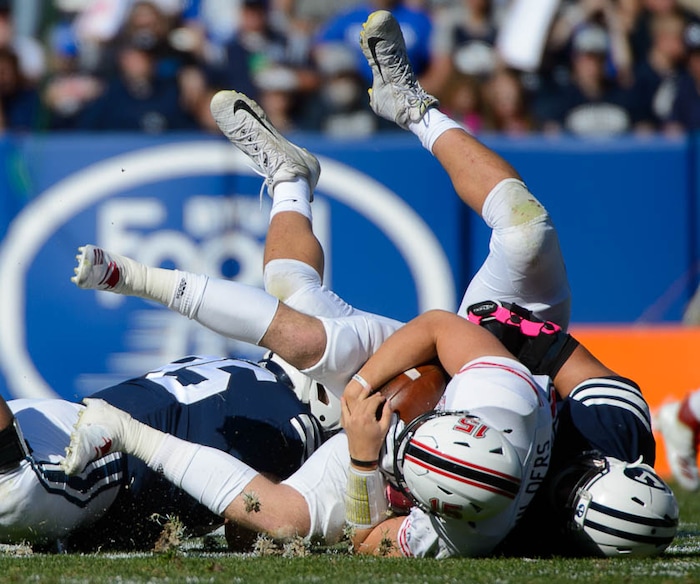 (Trent Nelson | The Salt Lake Tribune)  
Brigham Young Cougars defensive lineman Corbin Kaufusi (90) sacks Northern Illinois Huskies wide receiver Cole Tucker (18) as BYU hosts Northern Illinois, NCAA football in Provo, Saturday Oct. 27, 2018.