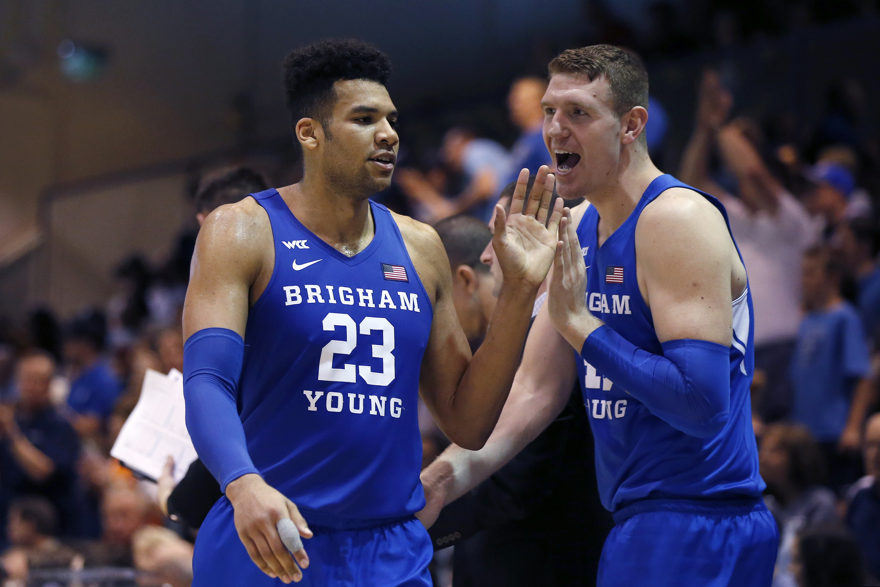 (Ringo H.W. Chiu | AP file photo) BYU forward Yoeli Childs (23) is greeted by Kolby Lee as he walks off the court during the second half of the team's NCAA college basketball game against Pepperdine on Saturday, Feb. 29, 2020, in Malibu, Calif.