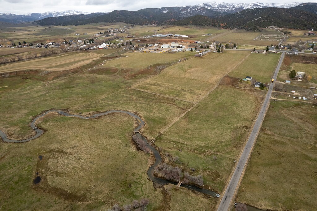 (Trent Nelson  |  The Salt Lake Tribune) Creamery Lane cuts through land that is set to be developed in Hoytsville on Tuesday, April 25, 2023.