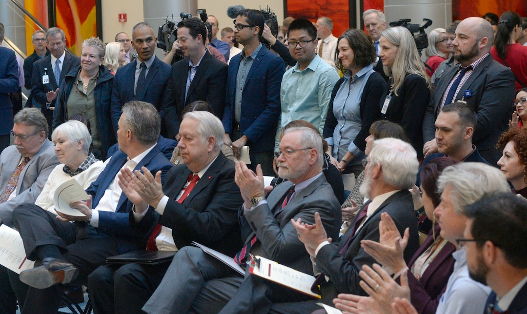 (Al Hartmann  |  The Salt Lake Tribune) 	Miller family and University of Utah Health Sciences leaders, (front row) applaud researchers (standing) who will work with the $5.3 million gift from Larry H. and Gail Miller Family Foundation to fight diabetes, called "Driving Out Diabetes:  A Larry H. Miller Wellness Initiative."