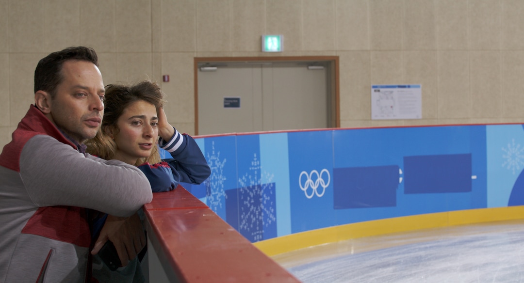 (Photo courtesy of IFC Films) Nick Kroll, left, plays Ezra, a volunteer dentist at the PyeongChang games, and Alexi Pappas, plays Penelope, an Olympic cross-country skier, in the romantic comedy "Olympic Dreams," filmed on location at the 2018 Winter Olympics. It opens Friday, Feb. 21, 2020, at the Broadway Centre Cinemas in Salt Lake City.