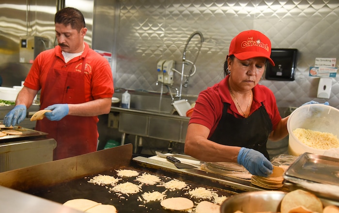 (Francisco Kjolseth  |  The Salt Lake Tribune)  Raul Aispuro and Lorena Torres fix tacos and fresh made tortillas at Tacos Mi Caramelo, a late-night taqueria that is open until 2 a.m. most nights and 24-hours a day on Friday and Saturday.
