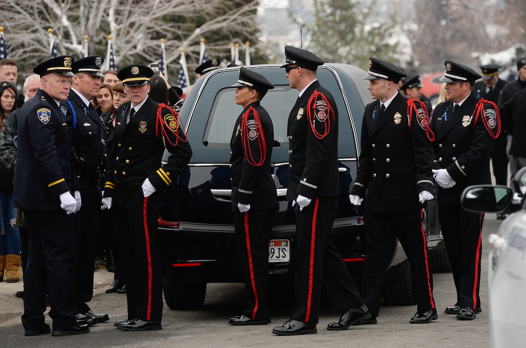 (Francisco Kjolseth  |  The Salt Lake Tribune)  The South Salt Lake Fire Department Honor Guard gather outside the hearse carrying police officer David Romrell during funeral services at Larkin Sunset Gardens Cemetery in Sandy, Wed. Dec. 5, 2018.