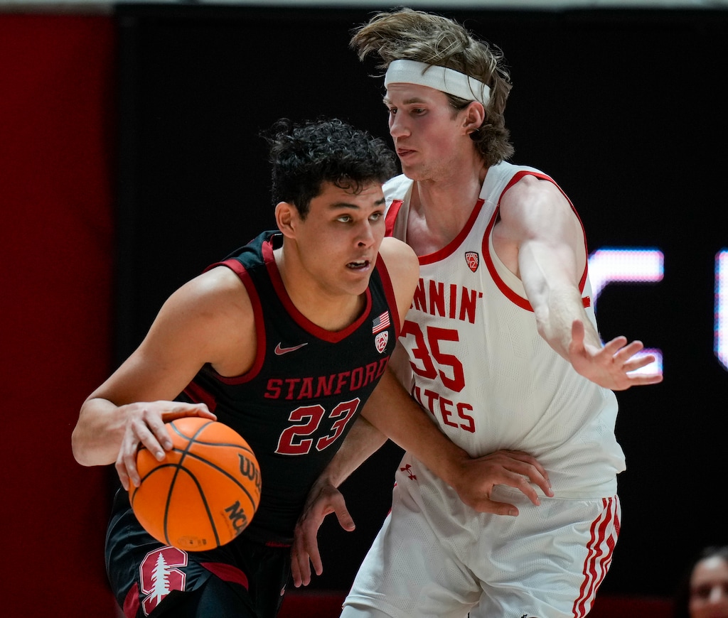 (Bethany Baker  |  The Salt Lake Tribune) Utah Utes center Branden Carlson (35) defends against Stanford Cardinal forward Brandon Angel (23) at Jon M. Huntsman Center in Salt Lake City Thursday, Feb. 29, 2024.