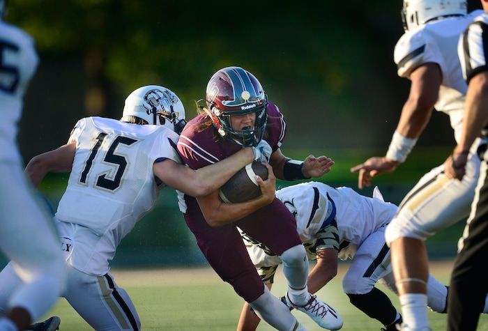 Scott Sommerdorf   |  The Salt Lake Tribune  Jordan QB Crew Wakley runs during first half play. Jordan led Desert Hills 21-0 at the half, Friday, August 19, 2016. 