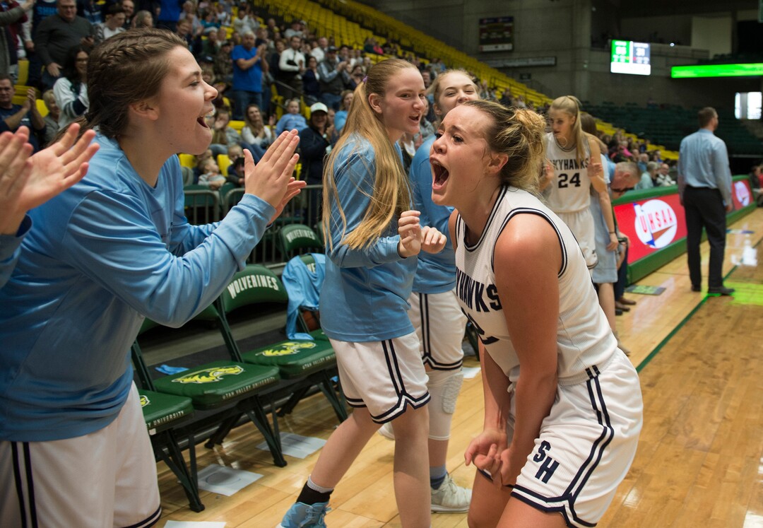 Scott Sommerdorf | The Salt Lake TribuneLauren Gustin, right, celebrates with team mates after she was taken out of the game late. Salem Hills beat Hurricane 57-35 for the 4A girl's title, Saturday, March 3, 2018.