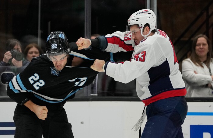 (Francisco Kjolseth | The Salt Lake Tribune) Utah Hockey Club center Jack McBain (22) fights Washington Capitals right wing Tom Wilson (43) during an NHL hockey game at the Delta Center in Salt Lake City on Monday, Nov. 18, 2024.