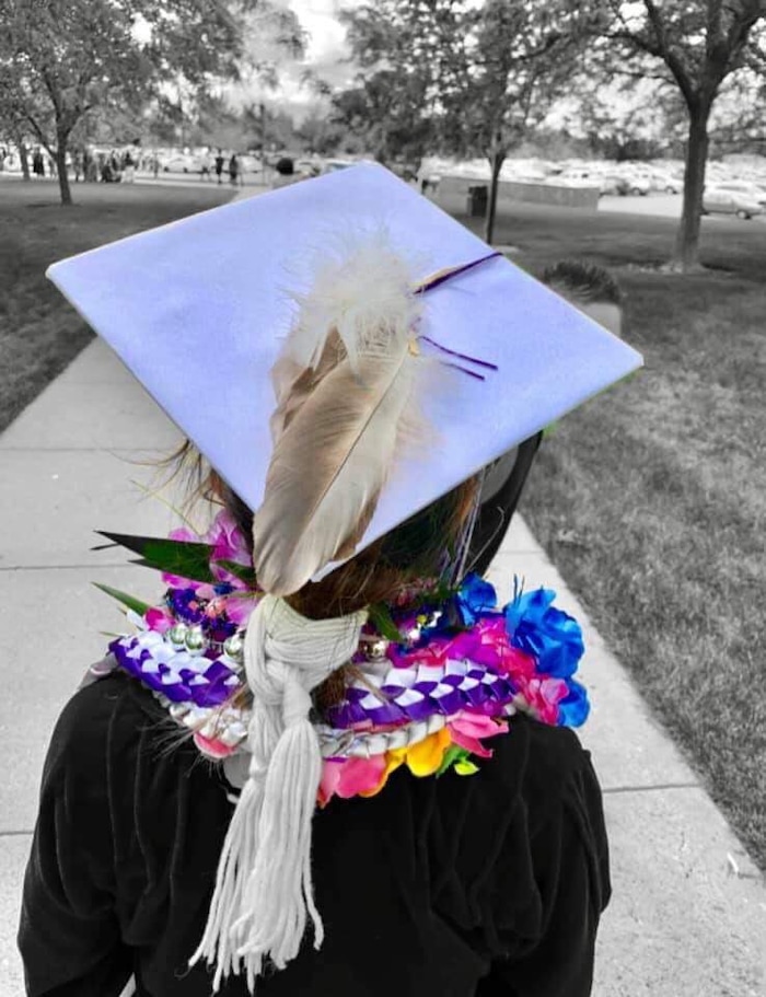 (Photo courtesy of Tasheena Savala) Pictured is Tasheena Savala with leis and decorations added after her graduation ceremony on May 29, 2019.