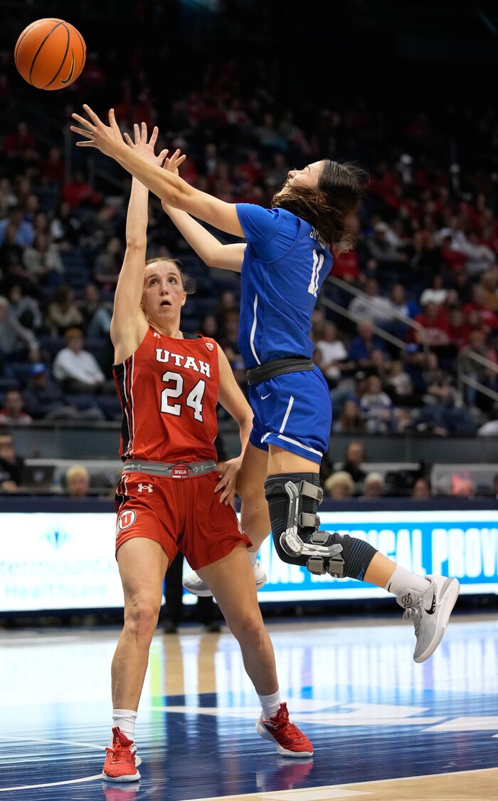 (Francisco Kjolseth | The Salt Lake Tribune) BYU Cougars guard Kaylee Smiler (11) shoots over Utah Utes guard Kennady McQueen (24) in basketball action between the Utah Utes and the Brigham Young Cougars, at the Marriott Center in Provo, on Saturday, Dec. 10, 2022.