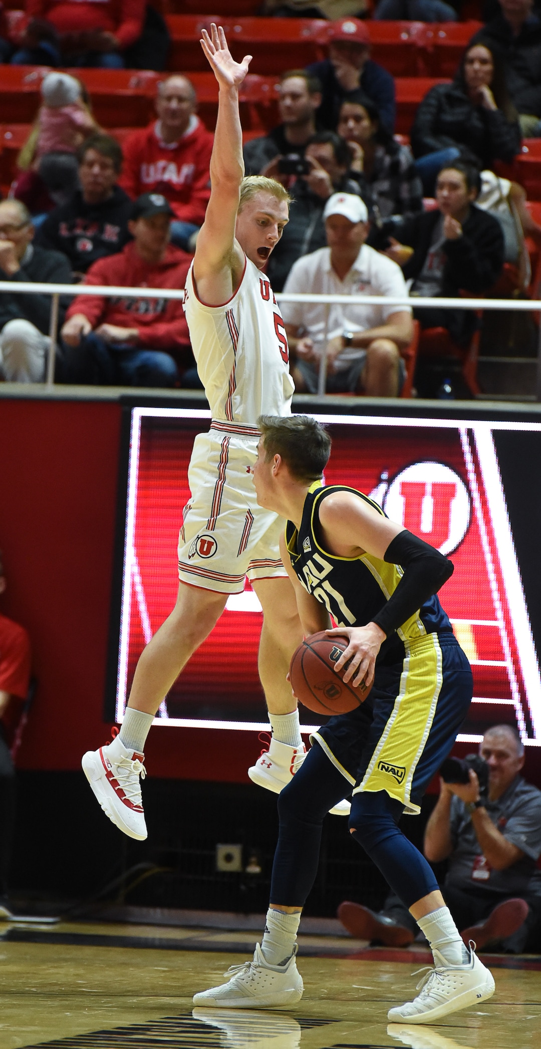 (Francisco Kjolseth  |  The Salt Lake Tribune)  Utah Utes guard Parker Van Dyke (5) anticipates a shot by Northern Arizona Lumberjacks guard Luke Avdalovic (21) in Men's Basketball at the Jon M Huntsman Center in Salt Lake City, Utah, on Friday, Dec. 21, 2018.
