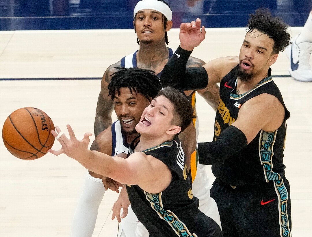 (Leah Hogsten | The Salt Lake Tribune) Utah Jazz center Derrick Favors (15) battles Memphis Grizzlies guard Grayson Allen (3) for the ball as the Utah Jazz take on the Memphis Grizzlies during Game 1 of the first-round playoffs at Vivint Arena, May 23, 2021.