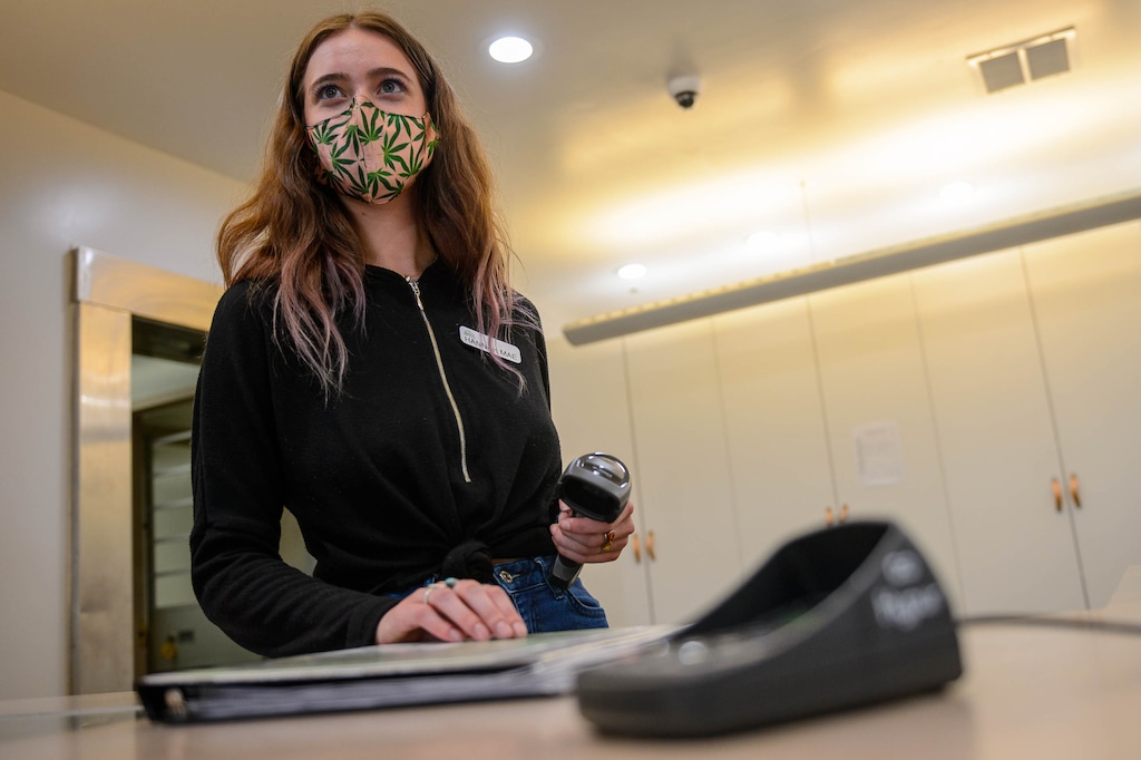 (Trent Nelson  |  The Salt Lake Tribune) Hannah Mae Popper with a Hypur keypad at Dragonfly Wellness in Salt Lake City on Wednesday, Sept. 23, 2020. Dragonfly Wellness is one of three cannabis pharmacies in Utah that are now accepting electronic payments over the Hypur application, allowing patients to pay without using cash.