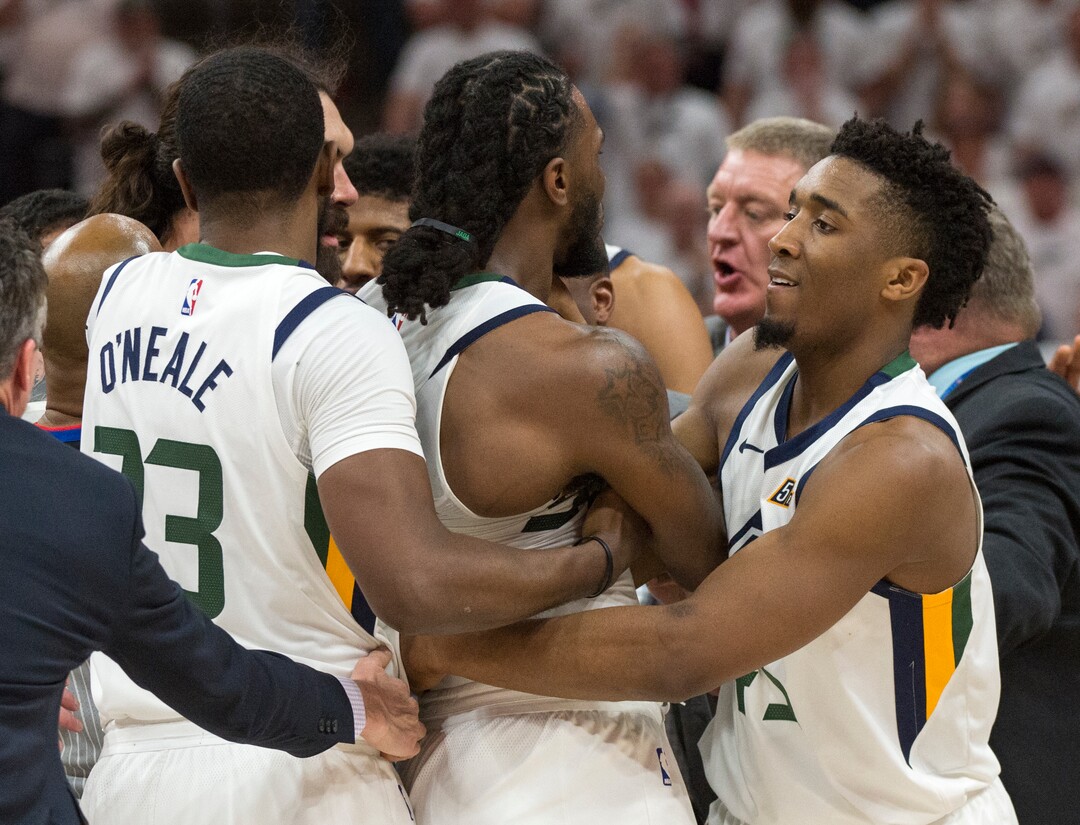 (Rick Egan  |  The Salt Lake Tribune)     Donovan Mitchell (45) drags Utah Jazz forward Jae Crowder (99) out of a shoving match, in NBA action in game 4, NBA playoff action between Utah Jazz and Oklahoma City Thunder, in Salt Lake City, Monday April 23, 2018.