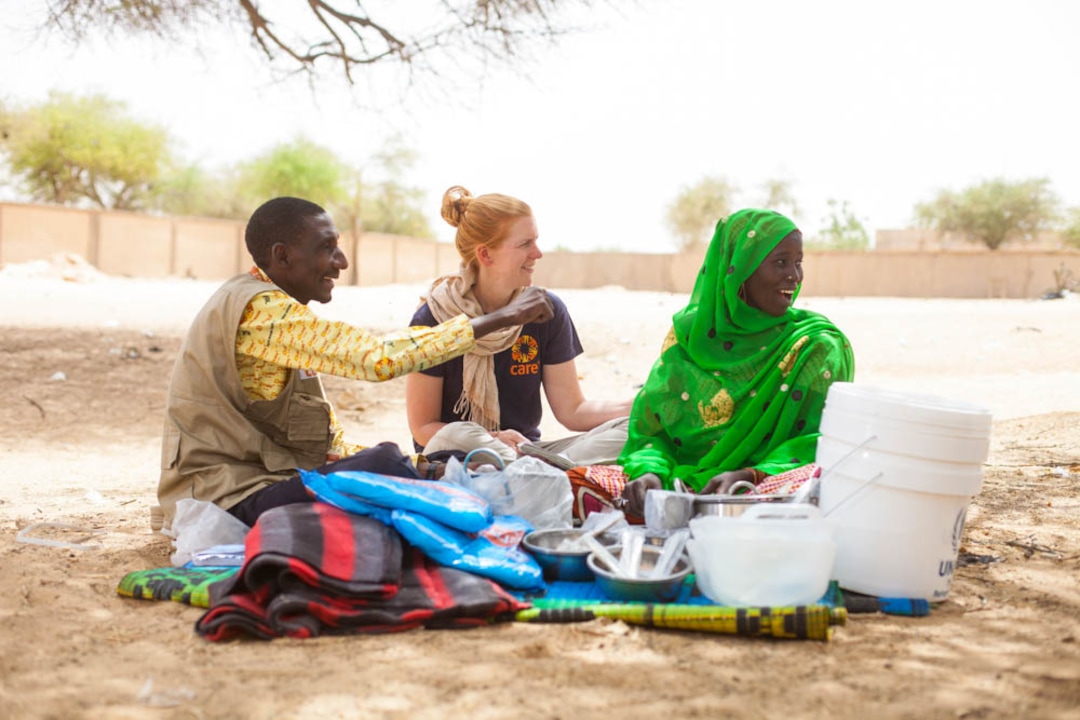 (Courtesy LDS Church; Photographer: Frederic Courbet)
Hadja Zena Mahamadou, a 30 year old Nigerian, inspects the relief items that CARE has distributed that day in the village of Gagamari. These include mats, blankets, kitchen supplies, soap, mosquito nets and buckets.