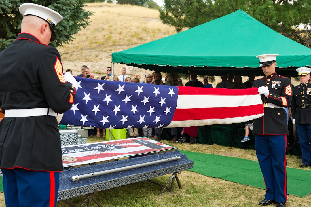 (Alex Gallivan  |  Special to The Tribune) Marine Pfc. Robert K. Holmes, who died 77 years ago aboard the USS Oklahoma during the attack on Pearl Harbor, is laid to rest in the Salt Lake City Cemetery, Monday, Aug. 20, 2018.
