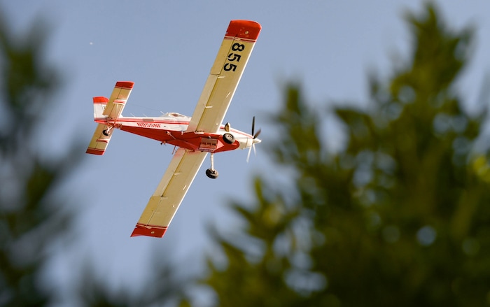 (Francisco Kjolseth  |  The Salt Lake Tribune) Fire crews battle a fire near Millcreek Canyon, on Saturday, July 11, 2020, started near 3400 South Crestwood Dr., as helicopters, single engine air tankers and multiple crews respond.