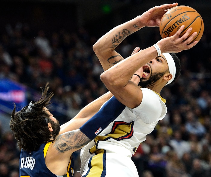 (Steve Griffin  |  The Salt Lake Tribune) Utah Jazz guard Ricky Rubio (3) fouls New Orleans Pelicans forward Anthony Davis (23) during the the Utah Jazz versus the New Orleans Pelicans NBA basketball game at the Vivint Smart Home Arena in Salt Lake City Wednesday January 3, 2018.