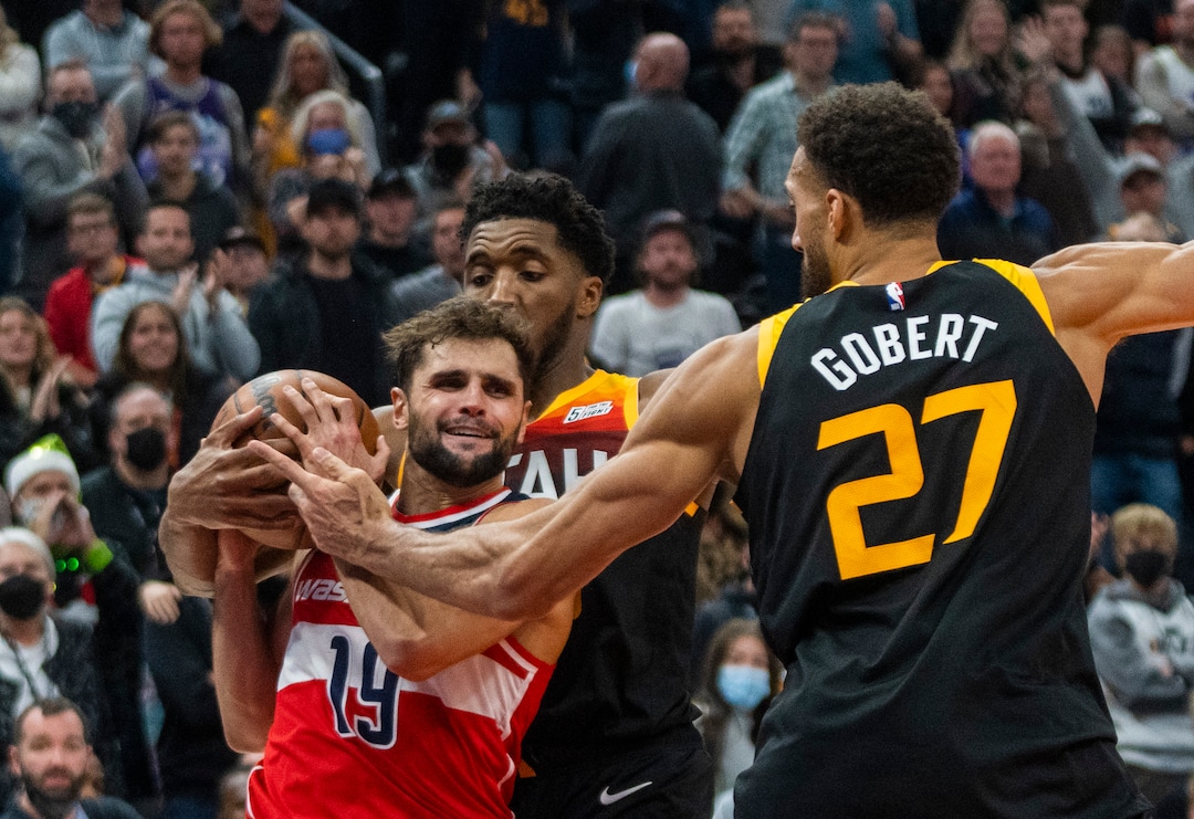 (Rick Egan | The Salt Lake Tribune) Utah Jazz guard Donovan Mitchell (45) holds on to the ball resulting in a jump ball with Washington Wizards guard Raul Neto (19), in the final minute of the game, in NBA action between the Utah Jazz and the Washington Wizards, at Vivint Arena on Saturday, Dec. 18, 2021.