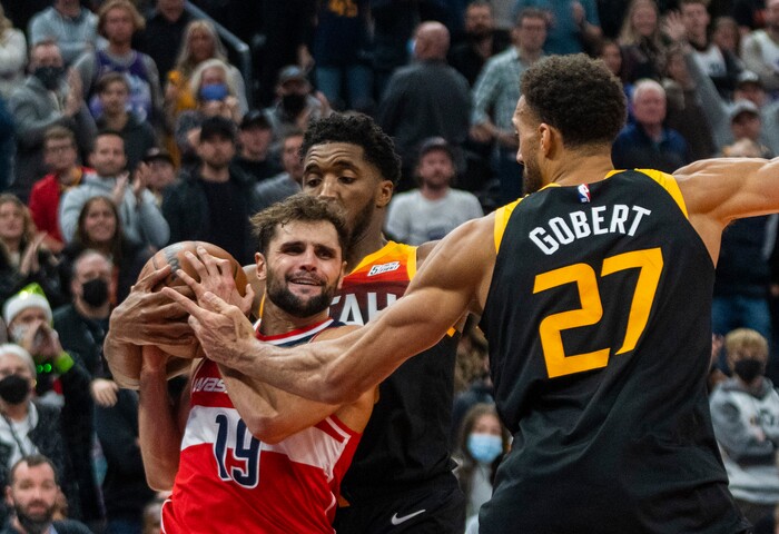 (Rick Egan | The Salt Lake Tribune) Utah Jazz guard Donovan Mitchell (45) holds on to the ball resulting in a jump ball with Washington Wizards guard Raul Neto (19), in the final minute of the game, in NBA action between the Utah Jazz and the Washington Wizards, at Vivint Arena on Saturday, Dec. 18, 2021.