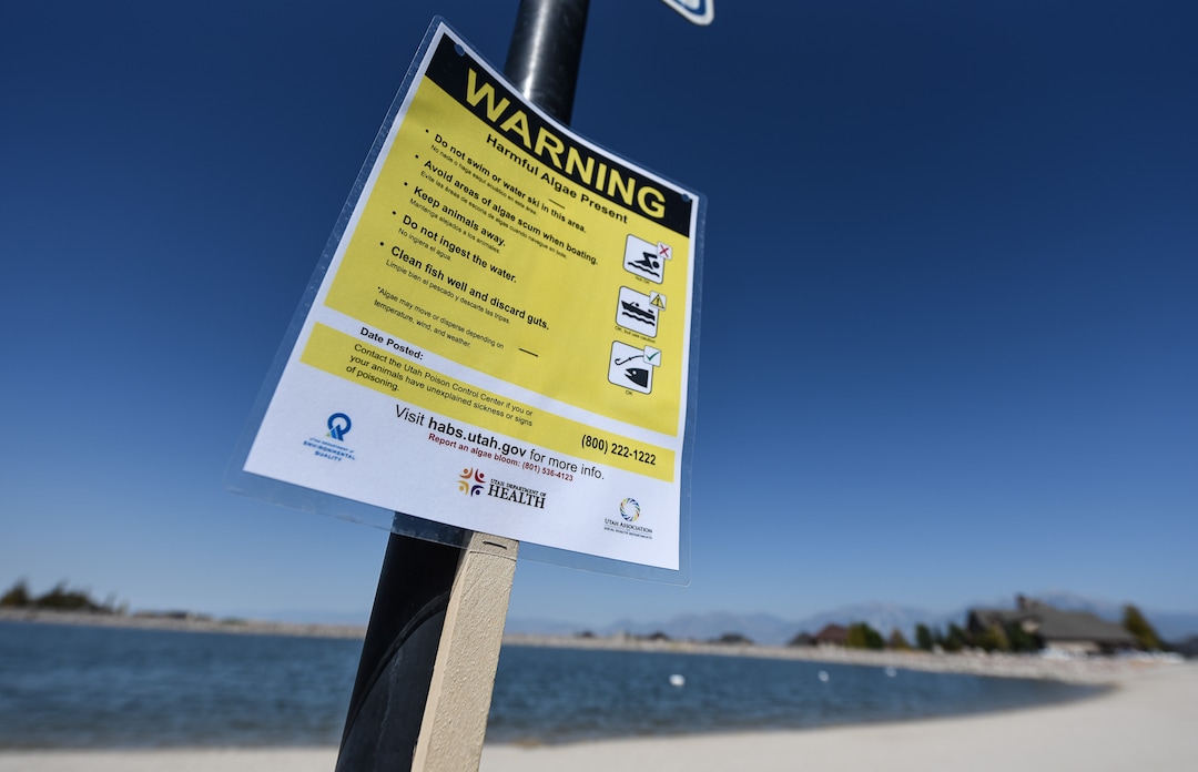 (Francisco Kjolseth  |  The Salt Lake Tribune)  Warning signs have been posted at popular recreation sites including Black Ridge Reservoir in Herriman on Tuesday, Aug. 28, 2018, after an outbreak of algae-related toxin cyanobacteria was detected in the water.