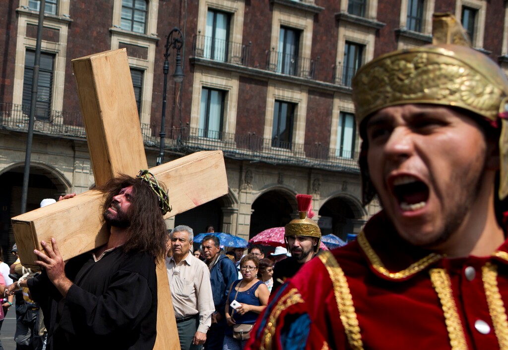 Actors from the theater group Fenix Novohispano perform in a Via Crucis, or Way of the Cross reenactment marking Good Friday, in the Zocalo, Mexico City's main square, Friday, March 30, 2018.(AP Photo/Rebecca Blackwell)