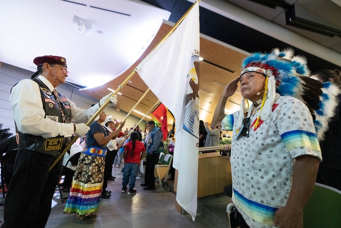 (Francisco Kjolseth | The Salt Lake Tribune) Benjamin Murray, left, with the Ute Indian Tribe Veterans Color Guard, posts the colors as Ute elder Larry Cesspooch  stands at attention for the 15th Annual Governor’s Native American Summit held on the Utah Valley University campus on Friday, Aug. 6, 2021.