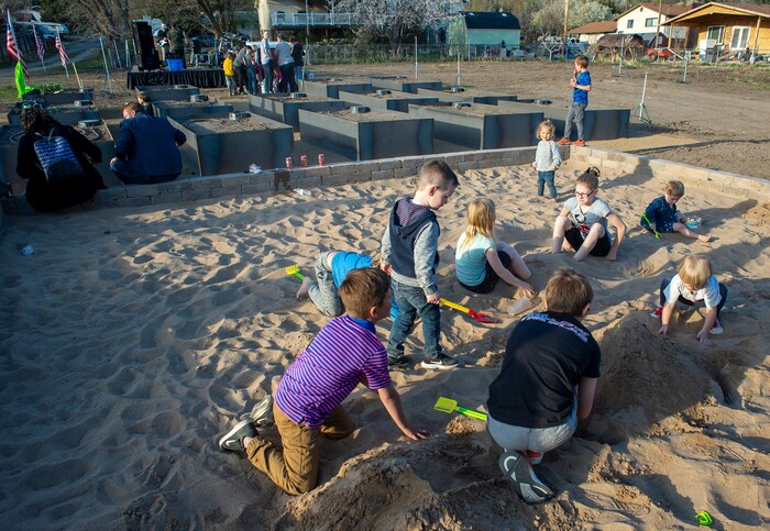 (Rick Egan | The Salt Lake Tribune)  Kids play in the new sand box, during the Earth Day Party at the Mini Taylor farm at at the Jennie Taylor's residence, in North Ogden. Taylor is the widow to the late Major. Brent Taylor, killed in 2018 while on Army National Guard duty in Afghanistan, donations have helped restore the small family farm, with planter boxes, a chicken coop, and a sandbox for the kids, on Thursday, April 22, 2021.