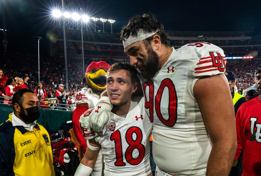 (Rick Egan | The Salt Lake Tribune)  Utah Utes wide receiver Britain Covey (18) and Utah Utes defensive tackle Devin Kaufusi (90) walk off the field after narrowly losing to Ohio State in the Rose Bowl in Pasadena, Calif., on Saturday, Jan. 1, 2022.