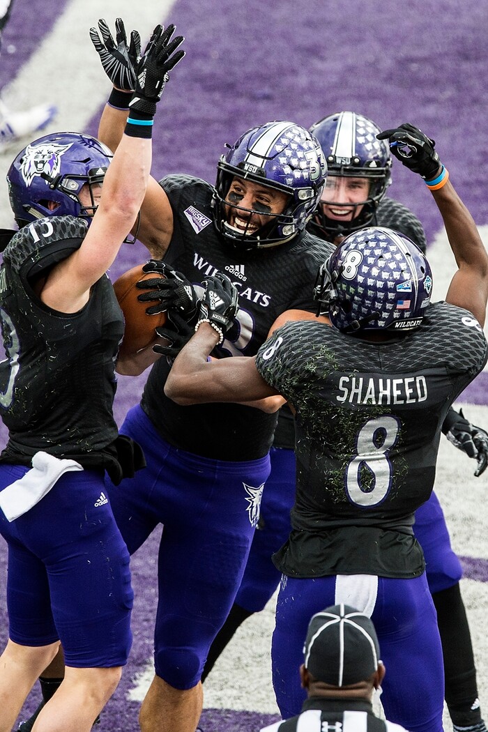 (Chris Detrick  |  The Salt Lake Tribune)  Weber State Wildcats wide receiver Drew Batchelor (13) celebrates with Weber State Wildcats tight end Tui Satuala (33) Weber State Wildcats wide receiver Rashid Shaheed (8) and Weber State Wildcats wide receiver Ty MacPherson (82) after making a touchdown catch during the game at Stewart Stadium Saturday, November 25, 2017.  