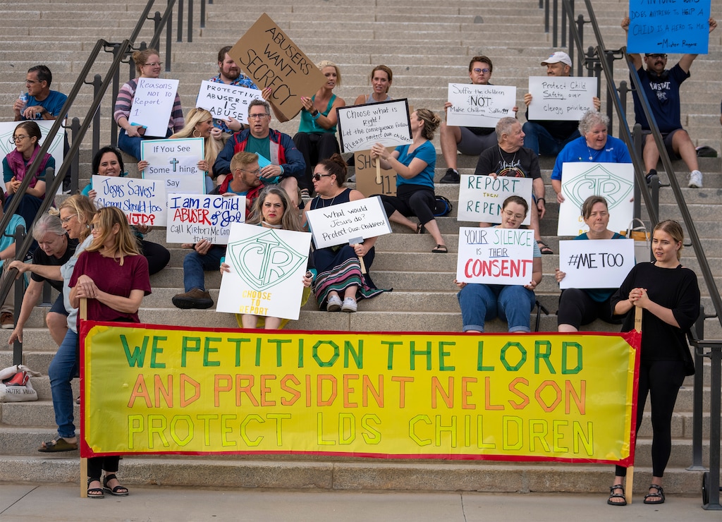 (Rick Egan | The Salt Lake Tribune)  Protesters gather on the steps of the Capitol for a rally to gain support for removing the clergy exemption from mandatory reporting in cases of abuse and neglect on Friday, Aug. 19, 2022.