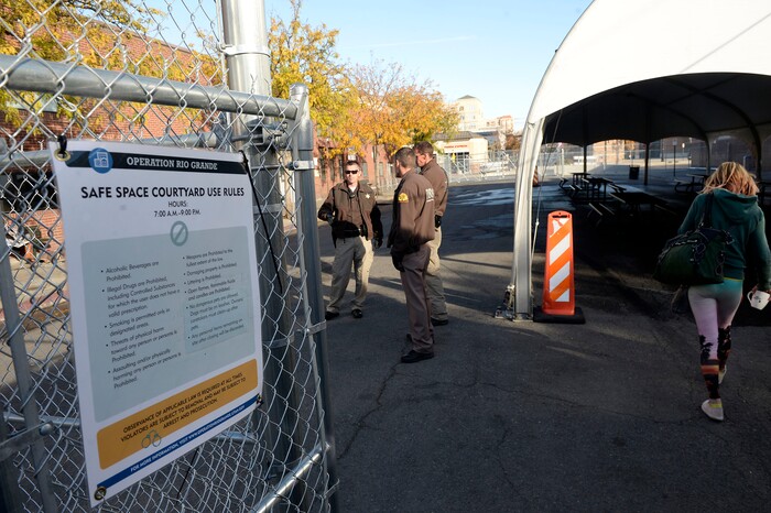 (Al Hartmann | The Salt Lake Tribune)
Starting Friday Oct. 27 homeless check in at booth to have their coordinated services card scanned before passing into the "safe space" courtyard outside the Road Home shelter. Security provided by the Utah Highway Patrol. The area is accessible from the south on Rio Grand Street. The area to the north at 200 South and Rio Grand is fenced and locked.
