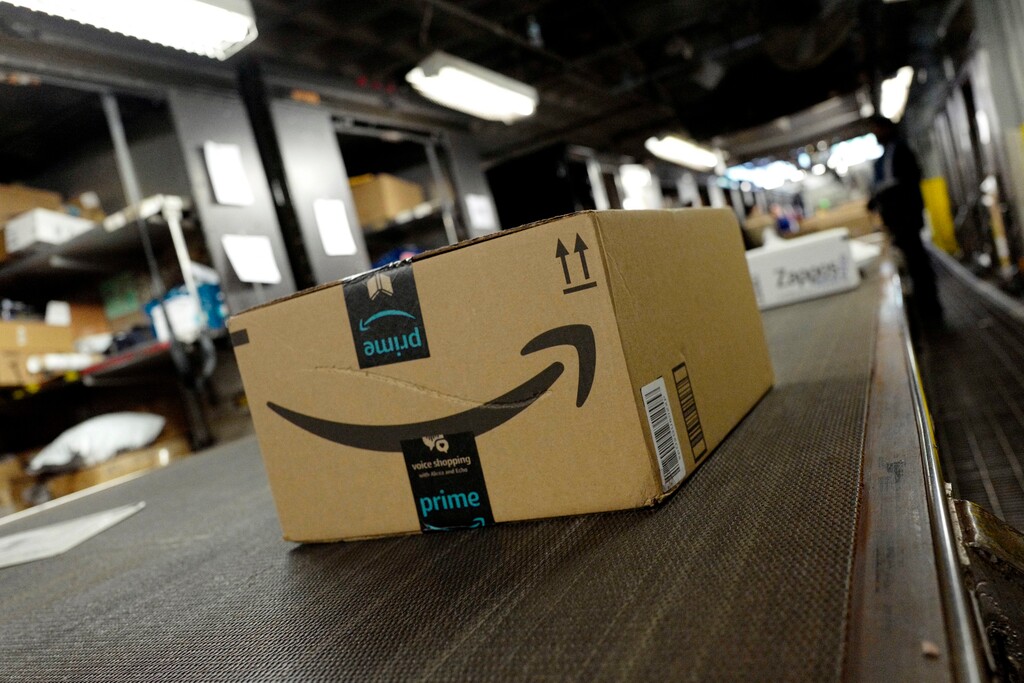 (Mark Lennihan | The Associated Press) In this May 9, 2017, file photo, a package from Amazon Prime moves on a conveyor belt at a UPS facility in New York. Amazon's Prime Day starts July 16, 2018, and will be six hours longer than last year's and will launch new products.
