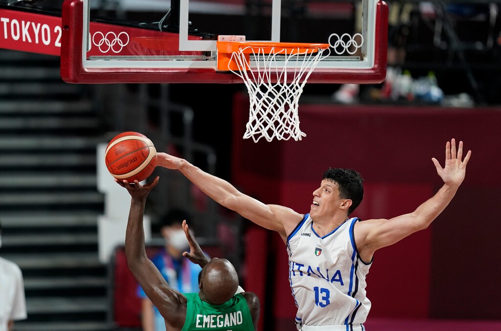 Italy's forward Simone Fontecchio (13), right, blocks shot by Nigeria's Obi Emegano (11), left, during men's basketball preliminary round game at the 2020 Summer Olympics, Saturday, July 31, 2021, in Saitama, Japan. (AP Photo/Charlie Neibergall)