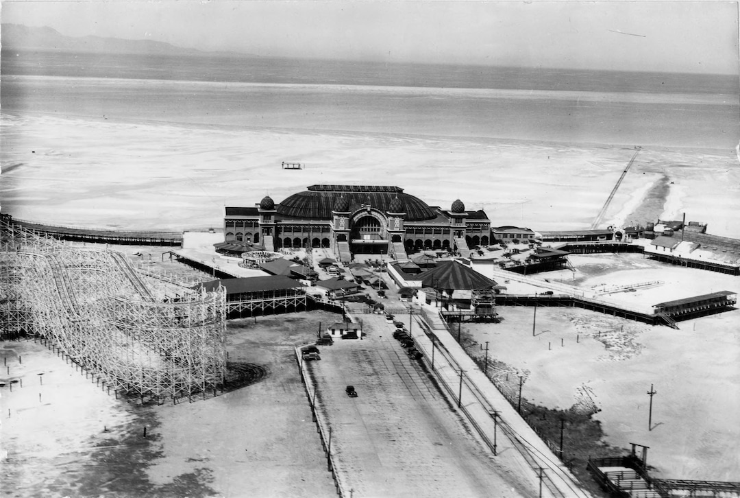 (Utah State Historical Society) A dilapidated Saltair II in the 1960s, after the resort was closed permanently in 1958. The ticket booth and parking lot, at left in the photograph,  was installed in the 1950s to appeal to car loads of visitors to the resort. 
